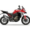 Red touring motorcycle on white background.