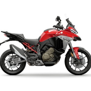 Red touring motorcycle on white background.