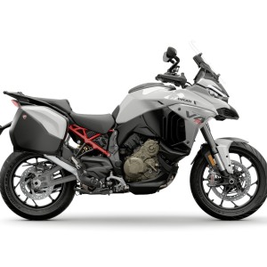 White adventure motorcycle with panniers.