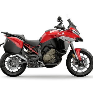 Red adventure motorcycle with saddlebags.