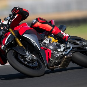 Motorcycle rider leaning into turn