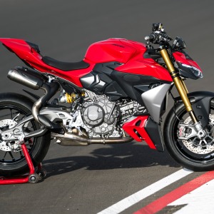 Red sport motorcycle on track.