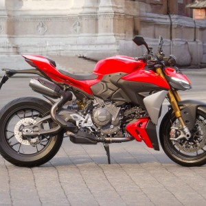 Red sport motorcycle parked on pavement