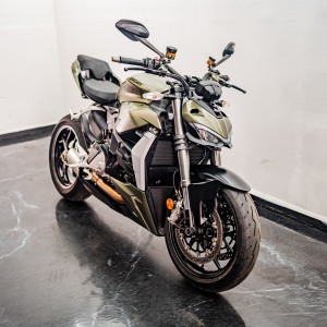 Green sport motorcycle on floor